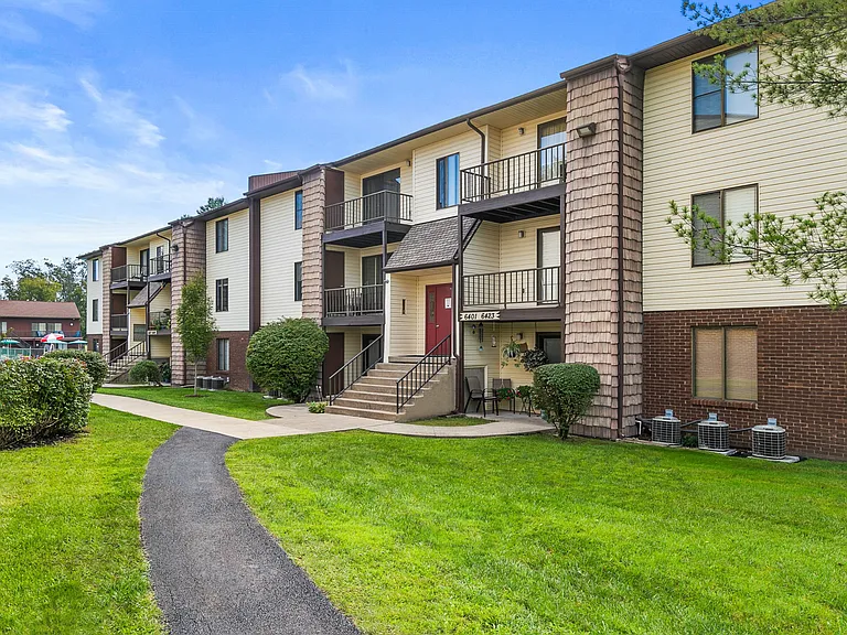 Apartment Building Exterior- featuring controlled access corridors, covered mailboxes, and intercom systems.