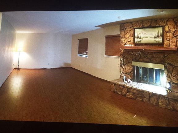 beautiful laminate flooring in main area, gas fireplace