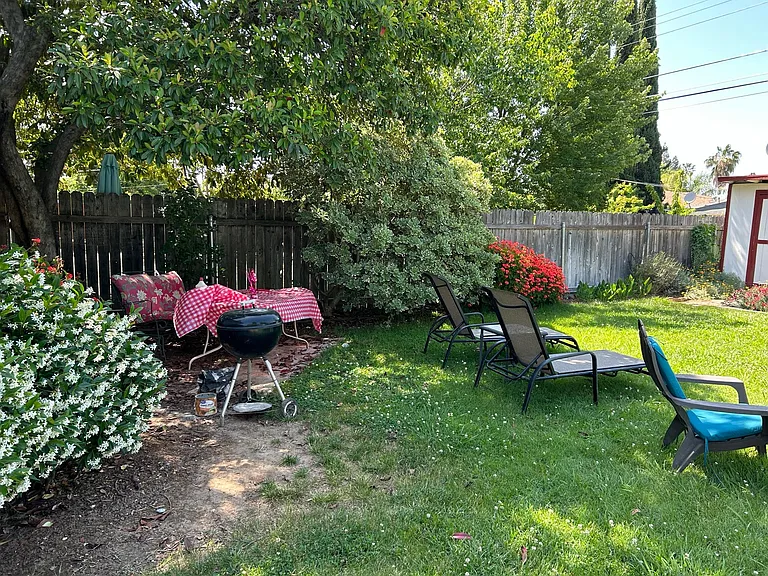 BBQ and lawn chairs available for use.