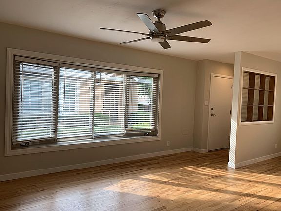 Front entrance living room with ceiling fan and air conditioning