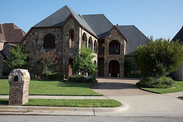 This traditional home has a dramatic street presence.