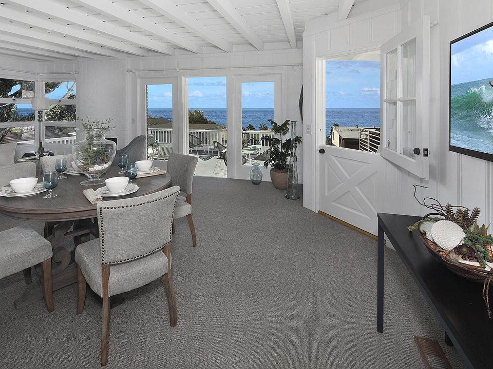 LIVING AND DINING AREA OPENS TO LARGE DECK