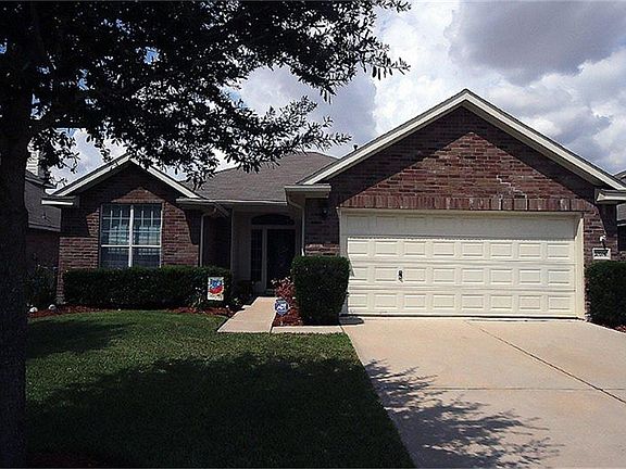 Three sides brick, 2 car garage with double wide driveway. Nice oak trees provide a lot of shade!