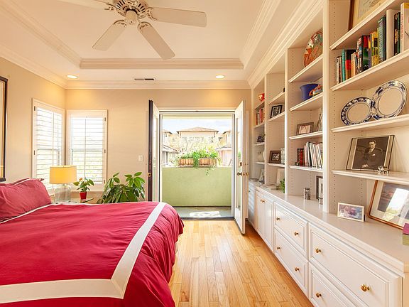 Master bedroom with private balcony and King bed