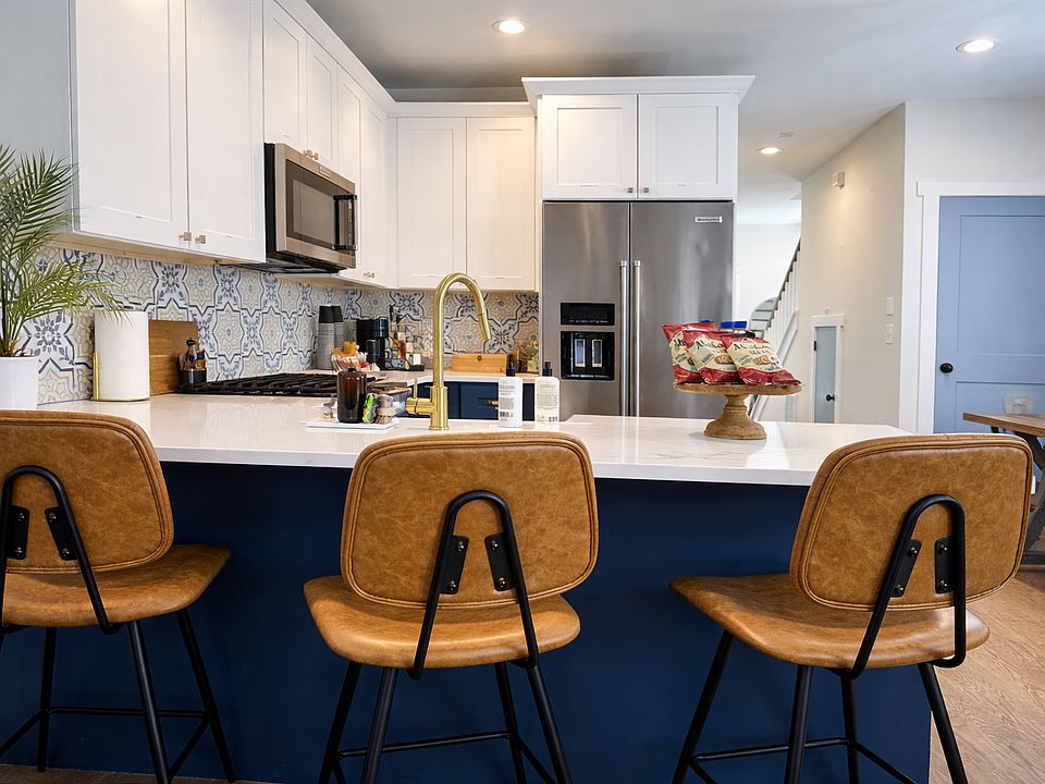 The island seats 3 with extra dining space for easy gatherings.
