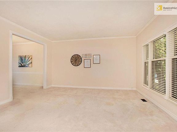 Enjoy a formal living room with crown molding.