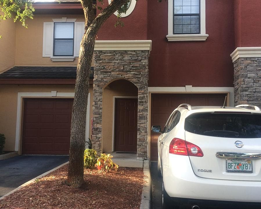 Driveway and garage attached to condo