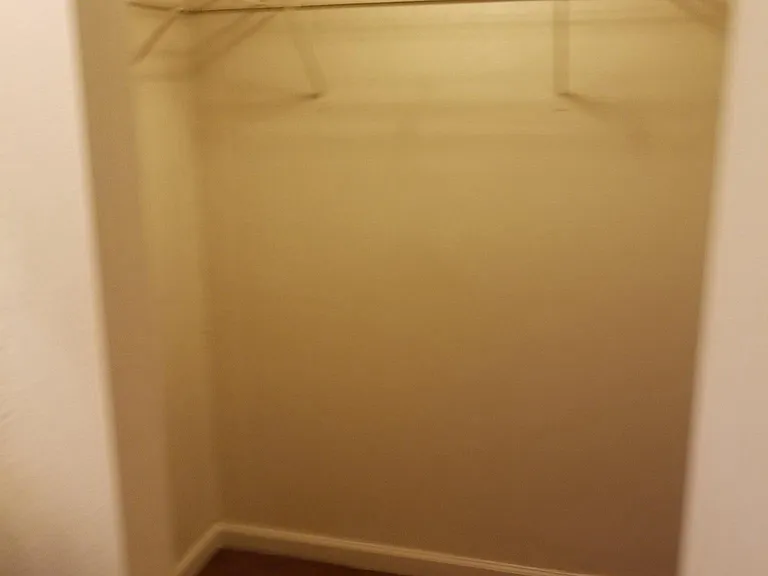 Walk in closet in the master bedroom in a 2x2
