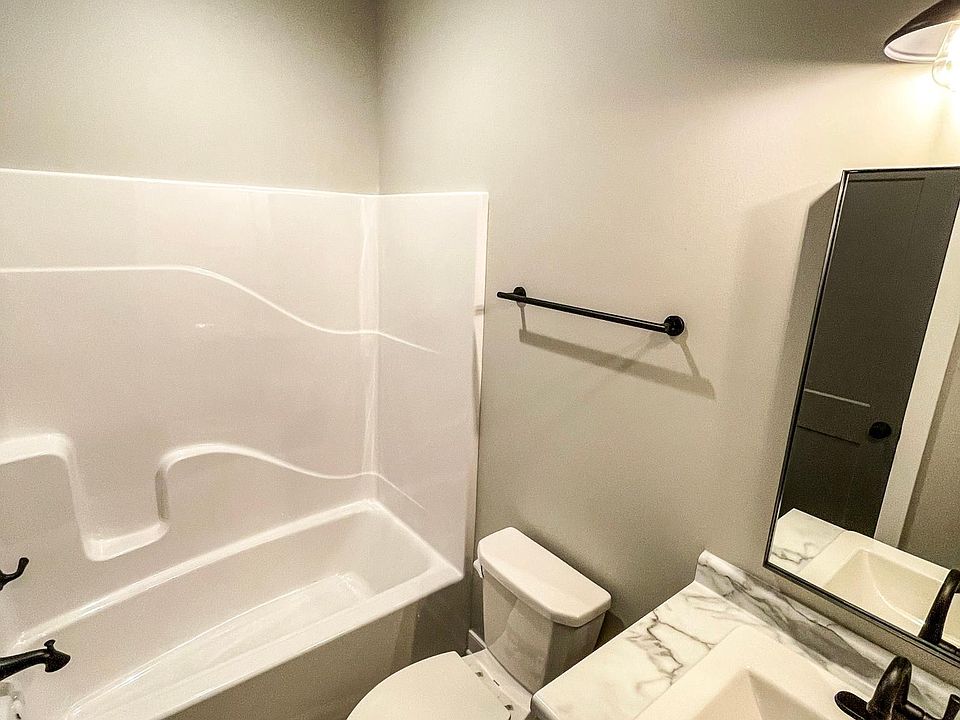 Bathroom 1, connected to bedroom and common areas