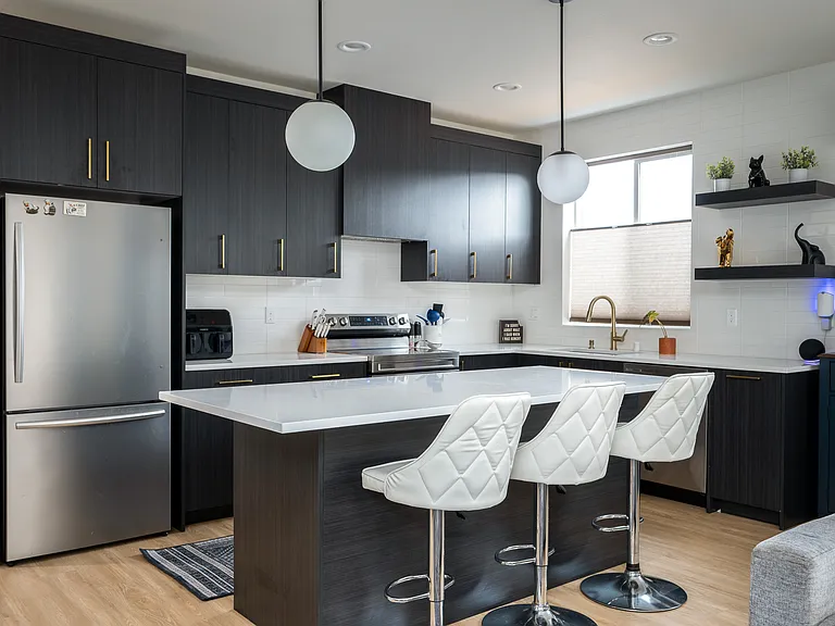 Kitchen with expansive quartz island and counter tops