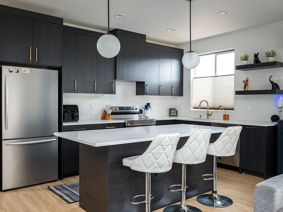 Kitchen with expansive quartz island and counter tops