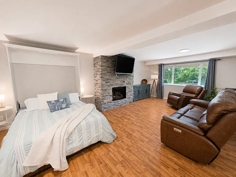 Family Room - Daylit Basement - Gas Fireplace - Large amount of Storage - Murphy Bed/Desk Office Area interchangeable - Adaptable for use as a Guest Suite with its own Bathroom.