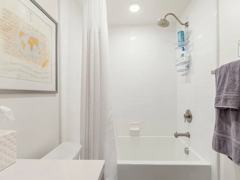 This is the private ensuite bathroom connected to the second bedroom. The Master bedroom and second bedroom are located on the lowest floor allowing extreme privacy and serenity.