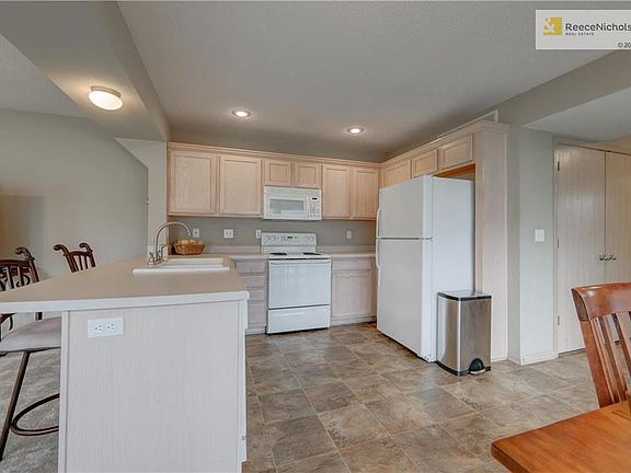 Kitchen with breakfast bar (all appliances stay).