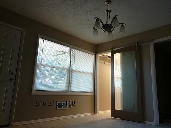 Roomy eat-in kitchen with door to the fenced yard. Bonus room on the right -- TV room or office.
