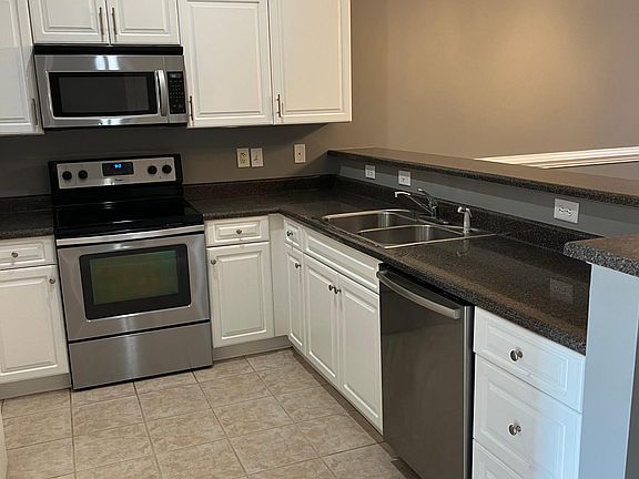 Stainless steel appliances installed summer of 2023. Sink has a disposal.