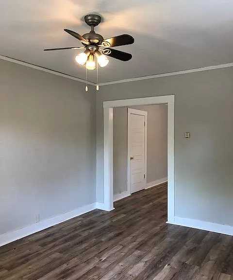 Living room opens to the another spacious room that can be used for the dining room and/or office. Wood laminate flooring, ceiling fan, windows for ample natural light.