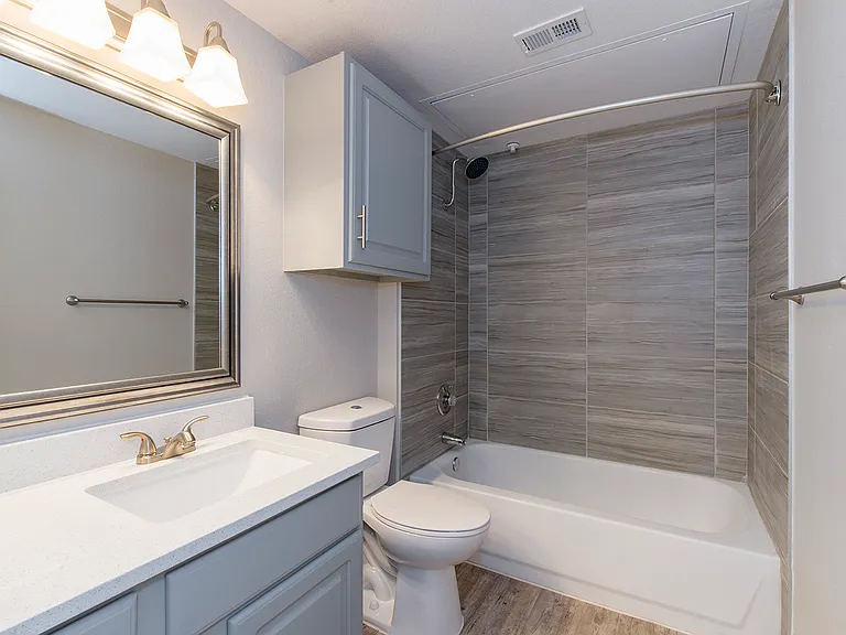 Updated bathroom with modern finishes and tiled shower