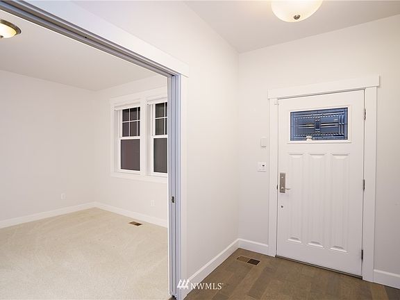 solid panel entrance door has decorative glass cut-in.