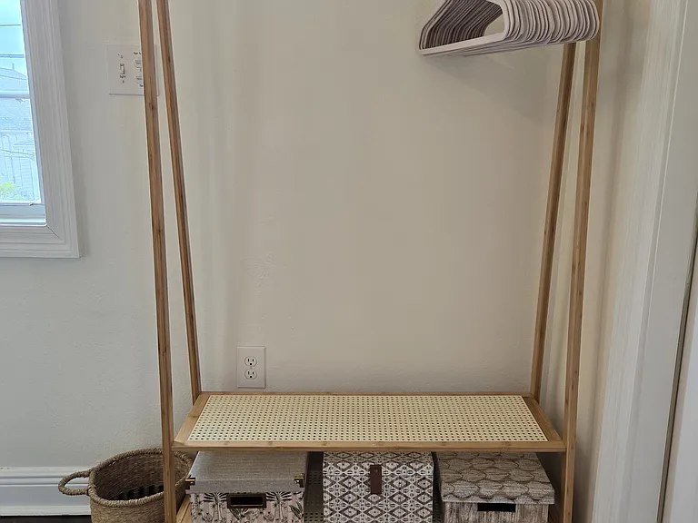 Hanging rack with extra storage for personal items