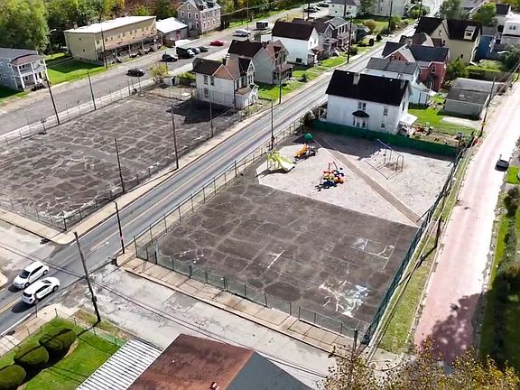 Sky view of park and basketball court located just steps away from home