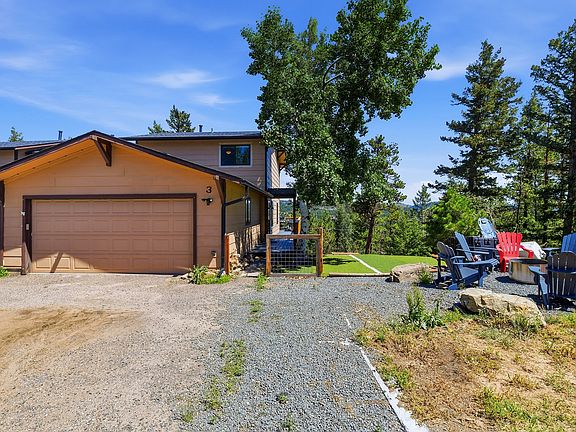 Welcome home! Enjoy mountain living with a spacious two-car garage, oversized driveway, private yard, and stunning Evergreen views_all tucked away on a quiet, wooded lot.