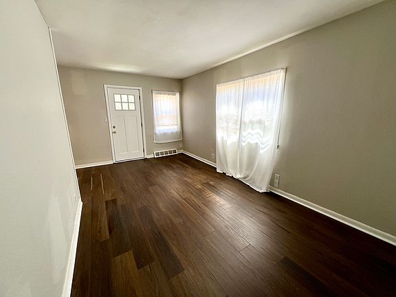 004_Living room looking at new front door with new flooring.