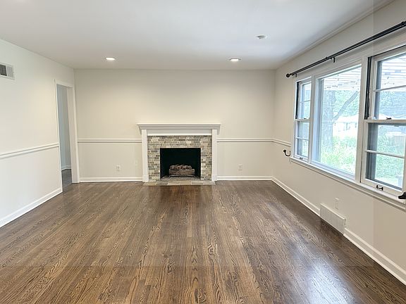 Family room (fireplace decorative only, bedrooms through the doorway on the left)