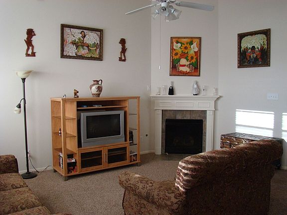 Family Room has High Ceilings, Open Floor Plan and a Warm, Cozy Fireplace