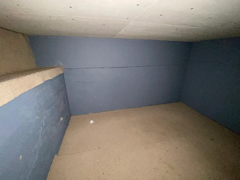 This is a separate, locking storage room in the basement.