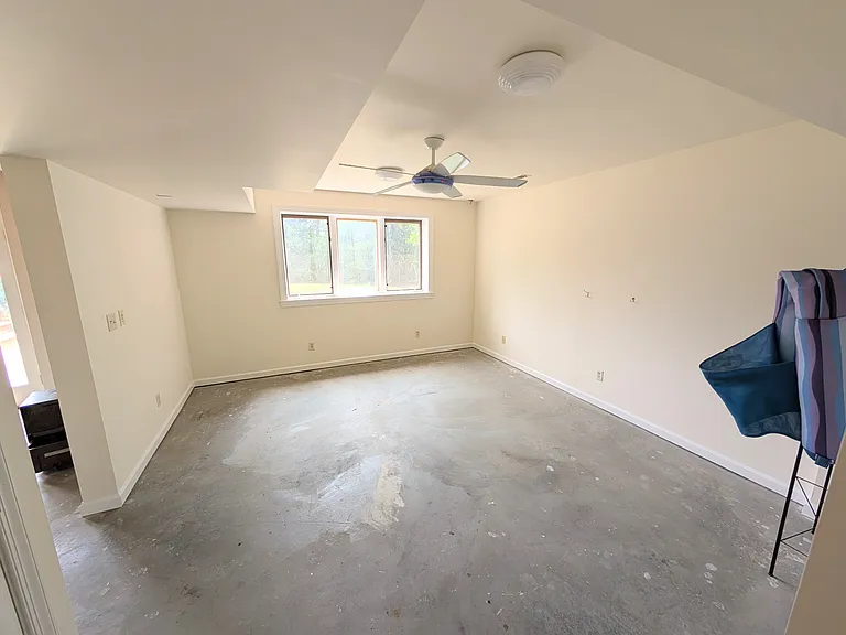 This is another basement room which looks out into the backyard. Most folks have used it as a gym. There's a full size bathroom too, so you can shower off after a workout.