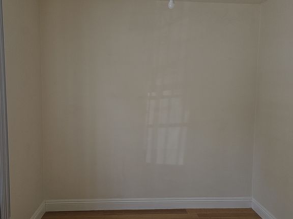 Formal dining room with window.