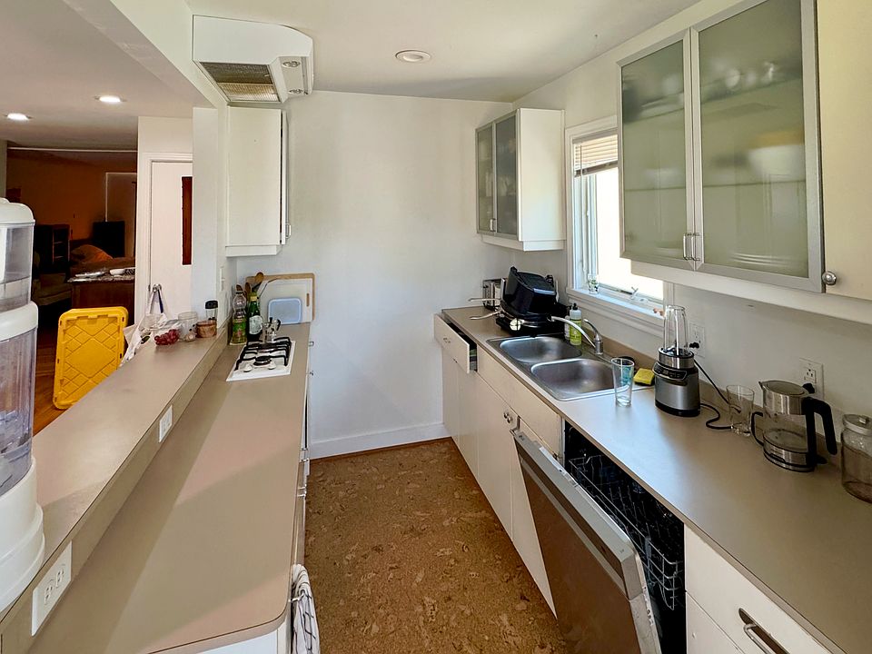 The compact kitchen is well organized for preparing simple meals.