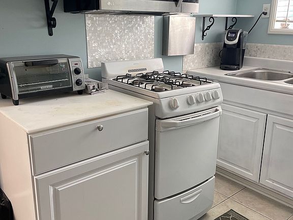 Kitchen area with microwave . toaster oven and prep counter