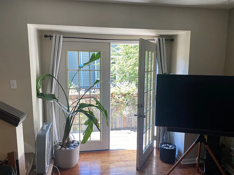 French doors open to deck and provide lots of sunlight
