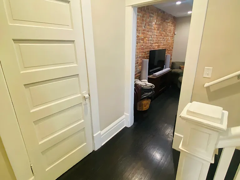 Hall with coat closet leading to Family Room