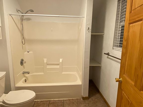 Full bathroom with tub and shower