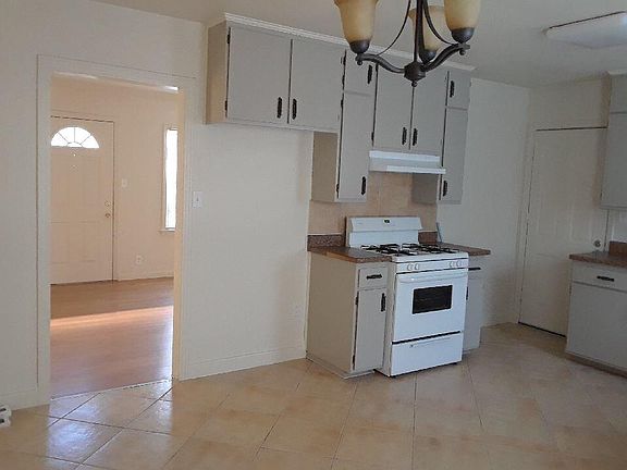 Nice-sized kitchen includes newer range/oven and dishwasher.