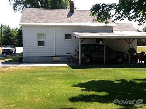 Back of home; viewing carport/patio.