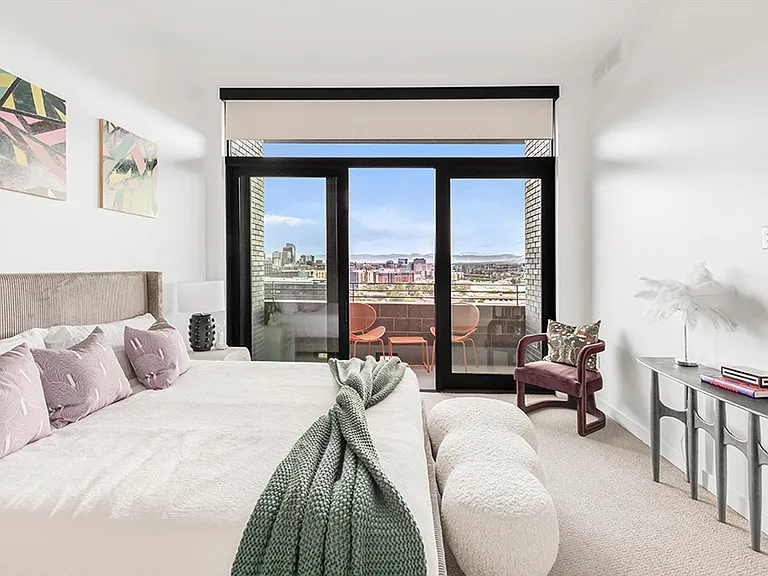 Primary bedroom with private balcony