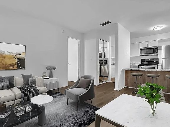 Step into this stylish apartment featuring a modern open-concept layout, elegant finishes, and inviting natural light-your perfect retreat awaits!