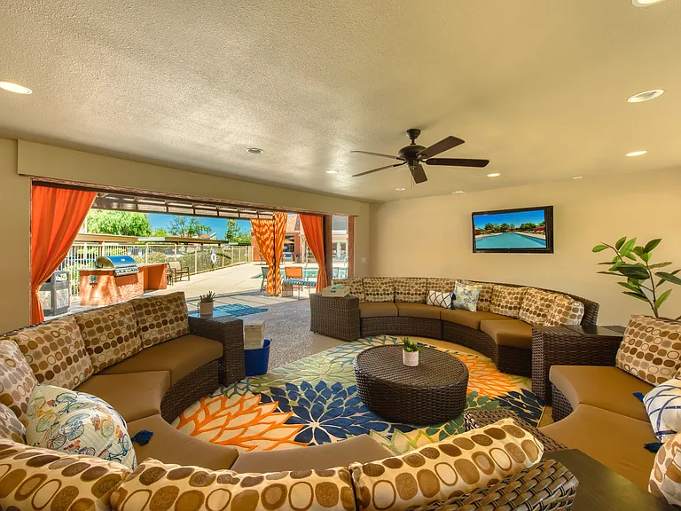 Resident lounge with shuffleboard and comfortable seating