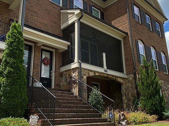 Entrance with screened porch and patio