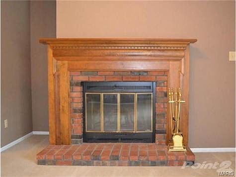 Close up of the wood burning fireplace - the fireplace tools can