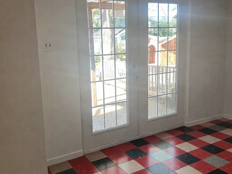 Sliding glass doors from main living area to the back yard