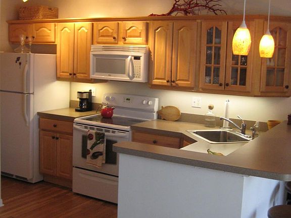 solid maple cabinets with undercabinet lighting