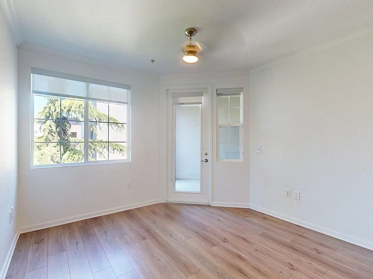 Apartment Living Room with large windows, wood-style flooring and ceiling light