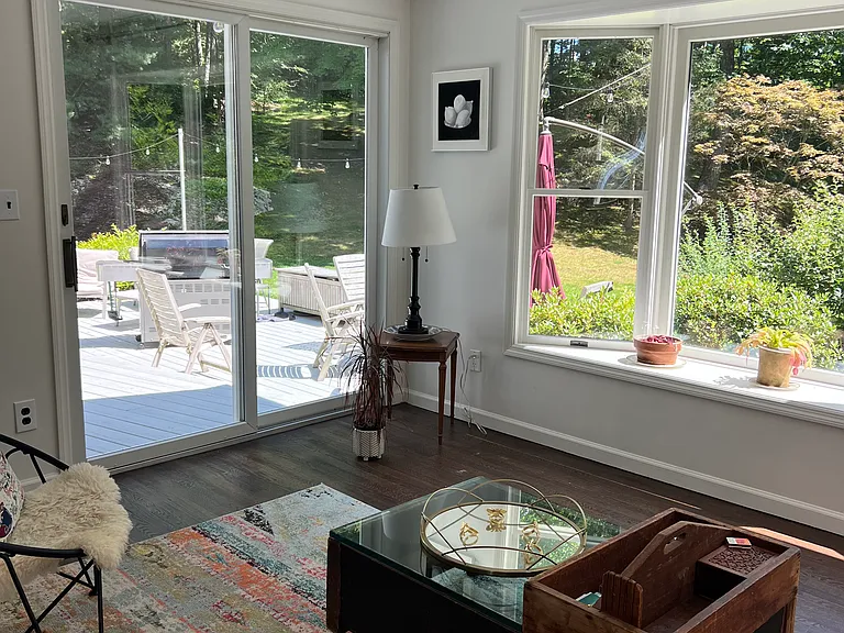 Sitting room off the main living area with views of the backyard & deck.