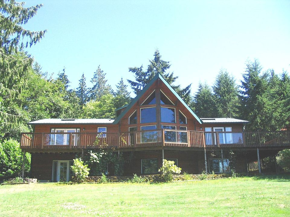 Front of home with full length deck.