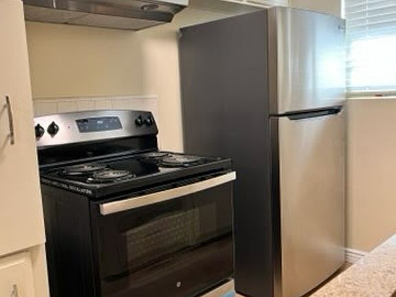 Kitchen with new stainless steel Appliances.